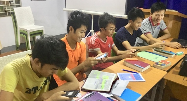 Students enjoying learning with Cursed to Bless